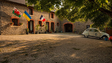 The completed enclosed courtyard at La Grosterie with a Citroën 2CV Perrier